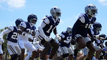 Jul 27, 2025; Oxnard, CA, USA; Dallas Cowboys defensive players run drills at training camp at the River Ridge Fields. Mandatory Credit: Kirby Lee-Imagn Images