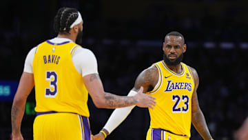 Mar 18, 2024; Los Angeles, California, USA; Los Angeles Lakers forward LeBron James (23) and forward Anthony Davis (3 celebrate against the Atlanta Hawks in the second half at Crypto.com Arena. Mandatory Credit: Kirby Lee-USA TODAY Sports