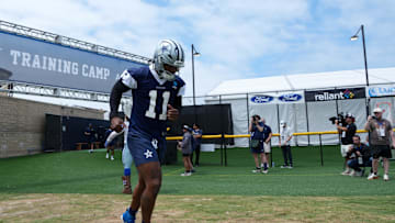 Jul 22, 2025; Oxnard, CA, USA; Dallas Cowboys defensive end Micah Parsons (11) enters the field during training camp at the River Ridge Fields. Mandatory Credit: Kirby Lee-Imagn Images