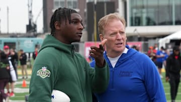 Apr 23, 2025; Green Bay, WI, USA; NFL commissioner Roger Goodell (right) talks with Miami Hurricanes quarterback Cam Ward aka Cameron Ward during the NFL Draft prospect clinic with Special Olympics at Draft Experience Field at Titletown. Mandatory Credit: Kirby Lee-Imagn Images