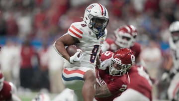 Dec 28, 2023; San Antonio, TX, USA; Arizona Wildcats running back DJ Williams (8) scores on a 19-yard touchdown run against the Oklahoma Sooners in the second half of the Alamo Bowl at Alamodome. Mandatory Credit: Kirby Lee-USA TODAY Sports
