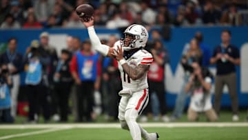 Dec 28, 2023; San Antonio, TX, USA; Arizona Wildcats quarterback Noah Fifita (11) throws the ball against the Oklahoma Sooners in the fist half of the Alamo Bowl at Alamodome. Mandatory Credit: Kirby Lee-USA TODAY Sports