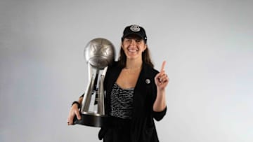 March 8, 2022; Las Vegas, NV, USA; Gonzaga Bulldogs head coach Lisa Fortier poses with the trophy after the game in the finals of the WCC Basketball Championships at Orleans Arena. Mandatory Credit: Kyle Terada-Imagn Images