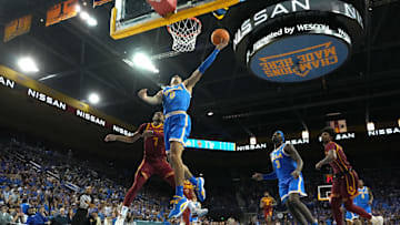UCLA Bruins guard Kobe Johnson shoots against Southern California Trojans guard Chibuzo Agbo.