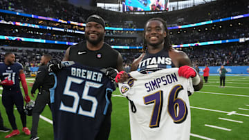 Oct 15, 2023; London, United Kingdom; Baltimore Ravens guard John Simpson (left) and Tennessee