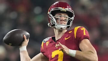 Dec 27, 2023; San Diego, CA, USA; Southern California Trojans quarterback Miller Moss (7) throws the ball against the Louisville Cardinalsin the first half of the Holiday Bowl at Petco Park. Mandatory Credit: Kirby Lee-Imagn Images