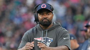 Oct 20, 2024; London, United Kingdom; New England Patriots coach Jerod Mayo watches from the sidelines against the New England Patriots in the second half of an NFL International Series game at Wembley Stadium. Mandatory Credit: Kirby Lee-Imagn Images