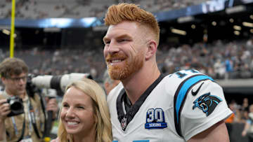 Sep 22, 2024; Paradise, Nevada, USA; Carolina Panthers quarterback Andy Dalton (14) poses with his wife Jordan Dalton before the game against the Las Vegas Raiders at Allegiant Stadium. Mandatory Credit: Kirby Lee-Imagn Images
