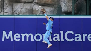 Aug 14, 2024; Anaheim, California, USA; Toronto Blue Jays left fielder Daulton Varsho (25) attempts to catch a fly ball double by Los Angeles Angels left fielder Taylor Ward (not pictured) in the second inning at Angel Stadium. Mandatory Credit: Kirby Lee-Imagn Images