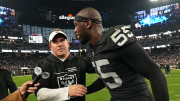 Dec 18, 2022; Paradise, Nevada, USA; Las Vegas Raiders coach Josh McDaniels (left) and defensive end