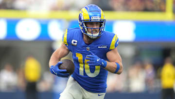 Dec 17, 2023; Inglewood, California, USA; Los Angeles Rams wide receiver Cooper Kupp (10) carries the ball against the Washington Commanders in the first half at SoFi Stadium. Mandatory Credit: Kirby Lee-Imagn Images