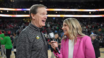 Mar 15, 2024; Las Vegas, NV, USA; Pac-12 Networks reporter Elise Woodward (right) interviews Oregon Ducks head coach Dana Altman after a game against the Arizona Wildcats at T-Mobile Arena. Mandatory Credit: Kirby Lee-Imagn Images