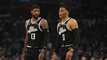 Feb 24, 2023; Los Angeles, California, USA; LA Clippers forward Paul George (13) and guard Russell Westbrook (0) react against the Sacramento Kings in the first half at Crypto.com Arena. Mandatory Credit: Kirby Lee-Imagn Images