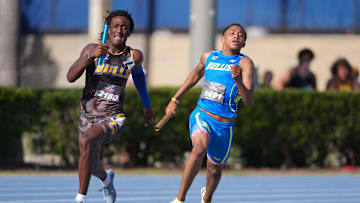 Apr 5, 2025; Gainesville, FL, USA; Tywan Cox of Miami Northwestern (left) defeats Quincy Wilson of Bullis on the anchor of the boys 4 x 400m relay, 3:08.74 to 3:09.97, during the Florida Relays at James G. Pressly Stadium. Mandatory Credit: Kirby Lee-Imagn Images