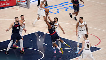 May 1, 2025; Inglewood, California, USA; LA Clippers guard James Harden (1) shoots the ball against Denver Nuggets guard Jamal Murray (27) during game six of first round for the 2025 NBA Playoffs at Intuit Dome. Mandatory Credit: Kirby Lee-Imagn Images