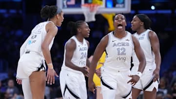Jul 29, 2025; Los Angeles, California, USA; Las Vegas Aces center A'ja Wilson (22) and guard Chelsea Gray (12) celebrate in the first half against the LA Sparks at Crypto.com Arena. 