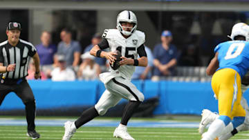 Sep 8, 2024; Inglewood, California, USA; Las Vegas Raiders quarterback Gardner Minshew (15) runs with the ball against the Los Angeles Chargers in the second half at SoFi Stadium. Mandatory Credit: Kirby Lee-Imagn Images