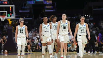 Aug 28, 2024; Los Angeles, California, USA; New York Liberty guard Courtney Vandersloot (22), forward Kayla Thornton (5), forward Nyara Sabally (8), forward Breanna Stewart (30) and guard Sabrina Ionescu (20) react against the LA Sparks in the second half at Crypto.com Arena.