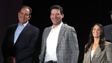 CBS Sports play-by-play announcer Jim Nantz, Tony Romo (center) and Tracy Wolfson at the Super Bowl 58 Media Center