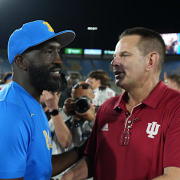 Sep 14, 2024; Pasadena, California, USA; UCLA Bruins head coach DeShaun Foster (left) and Indiana Hoosiers head coach Curt Cignetti shake hands after the game at Rose Bowl. Mandatory Credit: Kirby Lee-Imagn Images