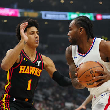 Mar 17, 2024; Los Angeles, California, USA; LA Clippers forward Kawhi Leonard (2) drives to the basket against Atlanta Hawks forward Jalen Johnson (1) in the first half at Crypto.com Arena. Mandatory Credit: Kirby Lee-Imagn Images