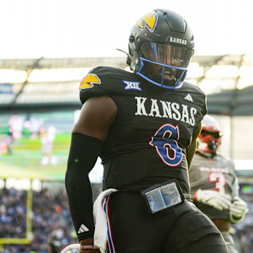 Sep 13, 2024; Kansas City, Kansas, USA; Kansas Jayhawks quarterback Jalon Daniels (6) scores a touchdown during the first half against the UNLV Rebels at Children's Mercy Park. Mandatory Credit: Jay Biggerstaff-Imagn Images