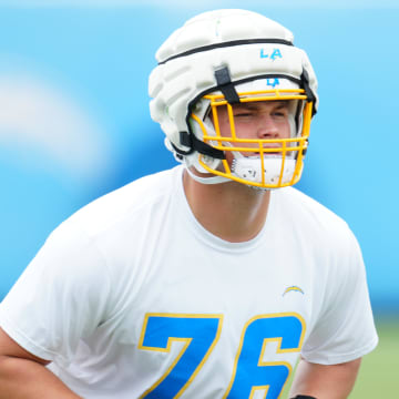 Los Angeles Chargers tackle Joe Alt (76) wears a Guardian helmet cap during organized team activities at the Hoag Performance Center. Mandatory Credit: Kirby Lee-USA TODAY Sports