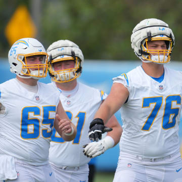 Jun 13, 2024; Costa Mesa, CA, USA; Los Angeles Chargers center Brent Laing (65), guard Karsen Barnhart (61) and offensive tackle Joe Alt (76) during minicamp at the Hoag Performance Center. Mandatory Credit: Kirby Lee-USA TODAY Sports