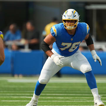 Aug 17, 2024; Inglewood, California, USA; Los Angeles Chargers offensive tackle Joe Alt (76) defends against Los Angeles Rams linebacker Zach VanValkenburg (51) in the first half at SoFi Stadium. Mandatory Credit: Kirby Lee-Imagn Images