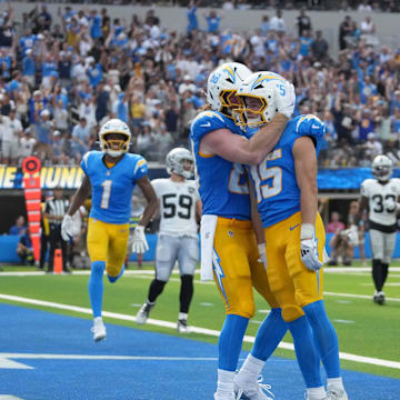 Sep 8, 2024; Inglewood, California, USA; Los Angeles Chargers wide receiver Ladd McConkey (15) celebrates with tight end Hayden Hurst (88) after scoring on a 15-yard touchdown reception against the Los Angeles Chargers in the second half at SoFi Stadium. Mandatory Credit: Kirby Lee-Imagn Images