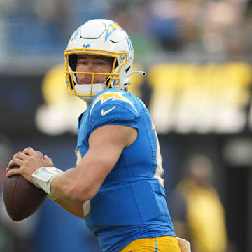 Sep 8, 2024; Inglewood, California, USA; Los Angeles Chargers quarterback Justin Herbert (10) throws the ball against the Las Vegas Raiders in the second half at SoFi Stadium. Mandatory Credit: Kirby Lee-Imagn Images