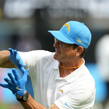 Aug 17, 2024; Inglewood, California, USA; Los Angeles Chargers coach Jim Harbaugh catches the ball during the game against th eLos Angeles Rams in the first half at SoFi Stadium. Mandatory Credit: Kirby Lee-Imagn Images