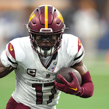 Dec 17, 2023; Inglewood, California, USA; Washington Commanders wide receiver Terry McLaurin (17) carries the ball against the Los Angeles Rams in the second half at SoFi Stadium. Mandatory Credit: Kirby Lee-Imagn Images