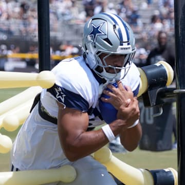 Dallas Cowboys tight end Brevyn Spann-Ford carries the ball at training camp at the River Ridge Fields.