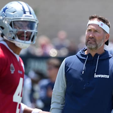 Dallas Cowboys coach Brian Schottenheimer watches quarterback Dak Prescott at training camp at the River Ridge Fields