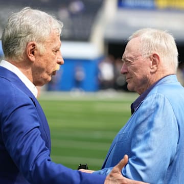 Los Angeles Rams owner Stan Kroenke talks with Dallas Cowboys owner Jerry Jones during the game at SoFi Stadium. 