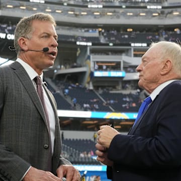 Dallas Cowboys owner Jerry Jones talks with Troy Aikman before the game against the Los Angeles Chargers