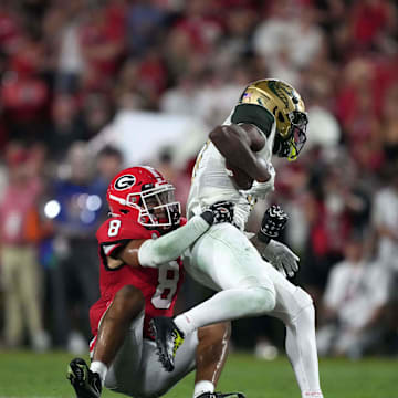 Sep 23, 2023; Athens, Georgia, USA; Georgia Bulldogs defensive back Joenel Aguero (8) tackles UAB Blazers receiver Amere Thomas (17) in the second half at Sanford Stadium. Mandatory Credit: Kirby Lee-Imagn Images