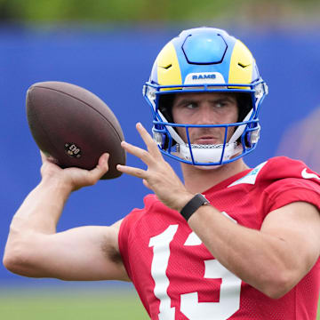 May 28, 2025; Woodland Hills, CA, USA; Los Angeles Rams quarterback Stetson Bennett (13) throws the ball during organized team activities at Rams Practice Facility. Mandatory Credit: Kirby Lee-Imagn Images