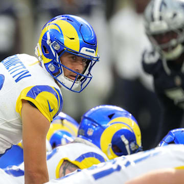 Aug 9, 2025; Inglewood, California, USA; Los Angeles Rams quarterback Stetson Bennett IV (13) takes the snap against the Dallas Cowboys in the first half at SoFi Stadium. Mandatory Credit: Kirby Lee-Imagn Images