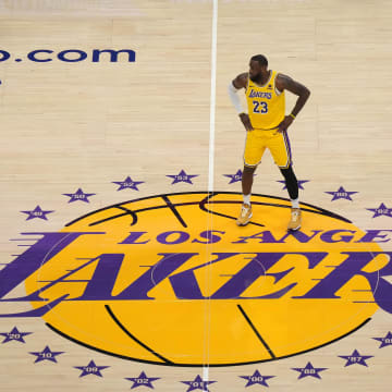 Jan 17, 2024; Los Angeles, California, USA; Los Angeles Lakers forward LeBron James (23) stands on the Lakers logo at center court in the first half against the Dallas Mavericks at Crypto.com Arena. Mandatory Credit: Kirby Lee-USA TODAY Sports