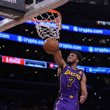 Nov 4, 2022; Los Angeles, California, USA; Los Angeles Lakers forward Troy Brown Jr. (7) dunks the ball against the Utah Jazz  in the first half at Crypto.com Arena. Mandatory Credit: Kirby Lee-Imagn Images