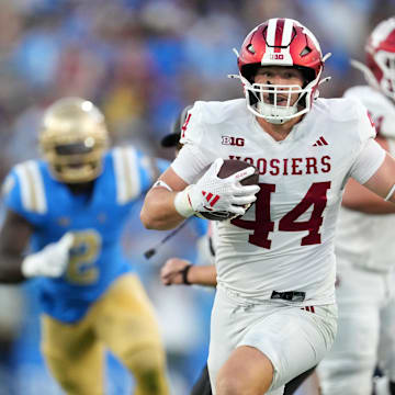 Indiana Hoosiers tight end Zach Horton (44) carries the ball against the UCLA Bruins in the second half at Rose Bowl.