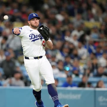 May 7, 2024; Los Angeles, California, USA; Los Angeles Dodgers third baseman Max Muncy (13) throws to first base against the Miami Marlins at Dodger Stadium. Mandatory Credit: Kirby Lee-USA TODAY Sports