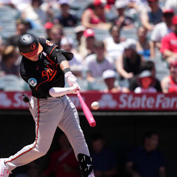 May 11, 2025; Anaheim, California, USA; Baltimore Orioles designated hitter Adley Rutschman (35) hits a RBI triple in the first inning against the Los Angeles Angels at Angel Stadium. 