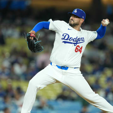 May 16, 2024; Los Angeles, California, USA; Los Angeles Dodgers pitcher Nick Ramirez (64) throws against the Cincinnati Reds  at Dodger Stadium. Mandatory Credit: Kirby Lee-USA TODAY Sports