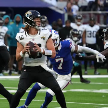 Oct 8, 2023; London United Kingdom; Jacksonville Jaguars quarterback Trevor Lawrence (16) throws the ball against the Buffalo Bills in the second half of an NFL International Series game at Tottenham Hotspur Stadium. Mandatory Credit: Kirby Lee-USA TODAY Sports