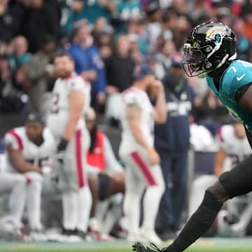 Oct 20, 2024; London, United Kingdom; Jacksonville Jaguars wide receiver Brian Thomas Jr. (7) celebrates after catching a 58-yard pass against New England Patriots cornerback Christian Gonzalez (0) in the first half of an NFL International Series game at Wembley Stadium. Mandatory Credit: Kirby Lee-Imagn Images