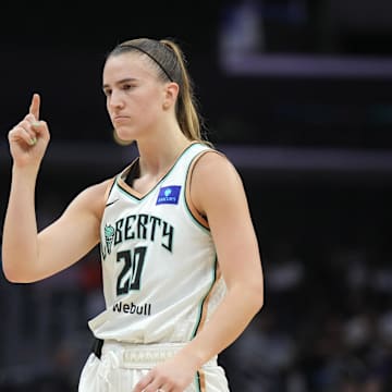 Aug 28, 2024; Los Angeles, California, USA; New York Liberty guard Sabrina Ionescu (20) gestures against the LA Sparks in the first half at Crypto.com Arena. Mandatory Credit: Kirby Lee-Imagn Images