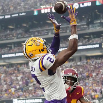 Sep 1, 2024; Paradise, Nevada, USA; LSU Tigers wide receiver Kyren Lacy (2) attempts to catch the ball against Southern California Trojans cornerback Jacobe Covington (14) at Allegiant Stadium. Mandatory Credit: Kirby Lee-Imagn Images